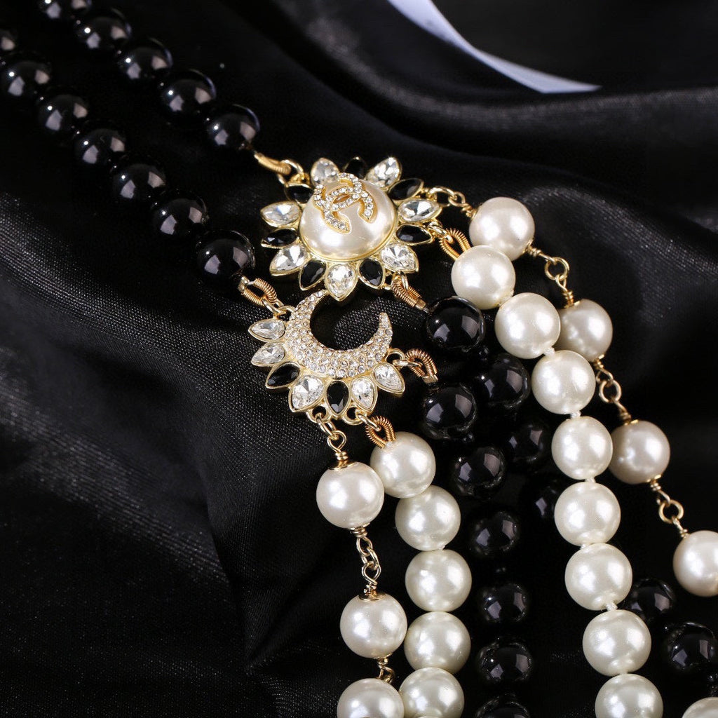 CHANEL 25S CHAIN BELT IN WHITE AND BLACK PEARL 614477