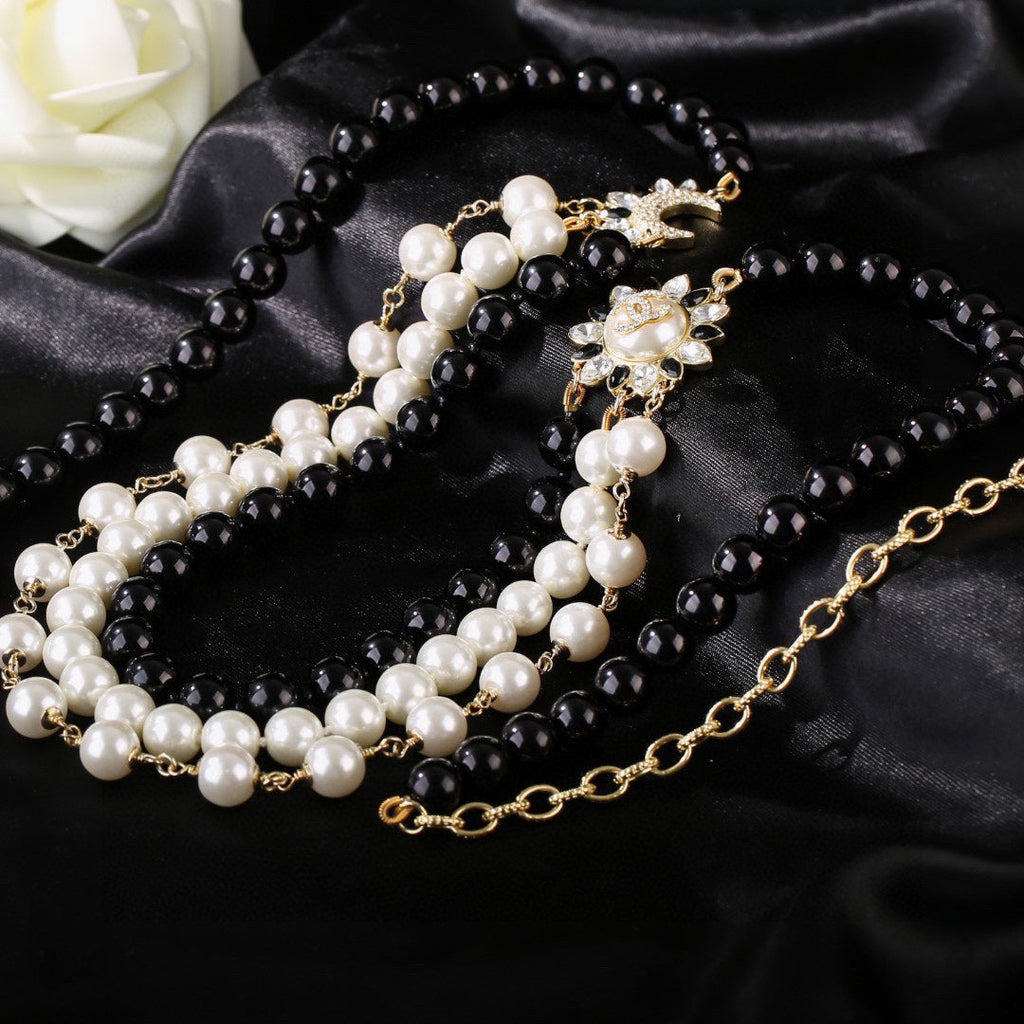 CHANEL 25S CHAIN BELT IN WHITE AND BLACK PEARL 614477