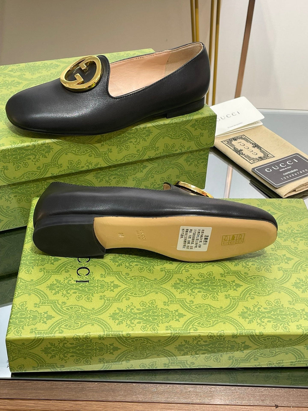 GUCCI BLONDIE LOGO-PLAQUE LOAFERS IN BLACK CALFSKIN WITH GOLD HARDWARE