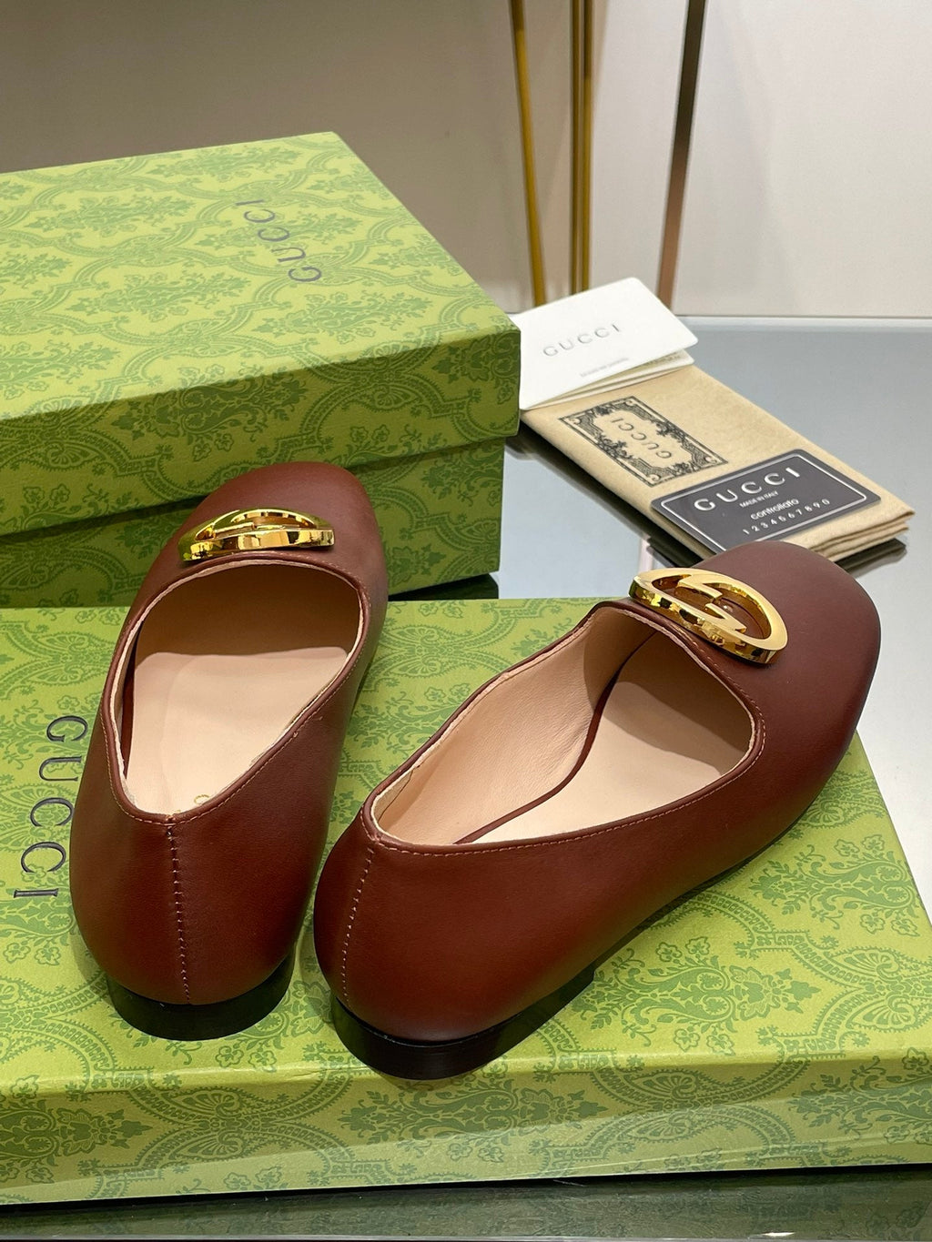 GUCCI BLONDIE LOGO-PLAQUE LOAFERS IN SYRUP BROWN CALFSKIN WITH GOLD HARDWARE