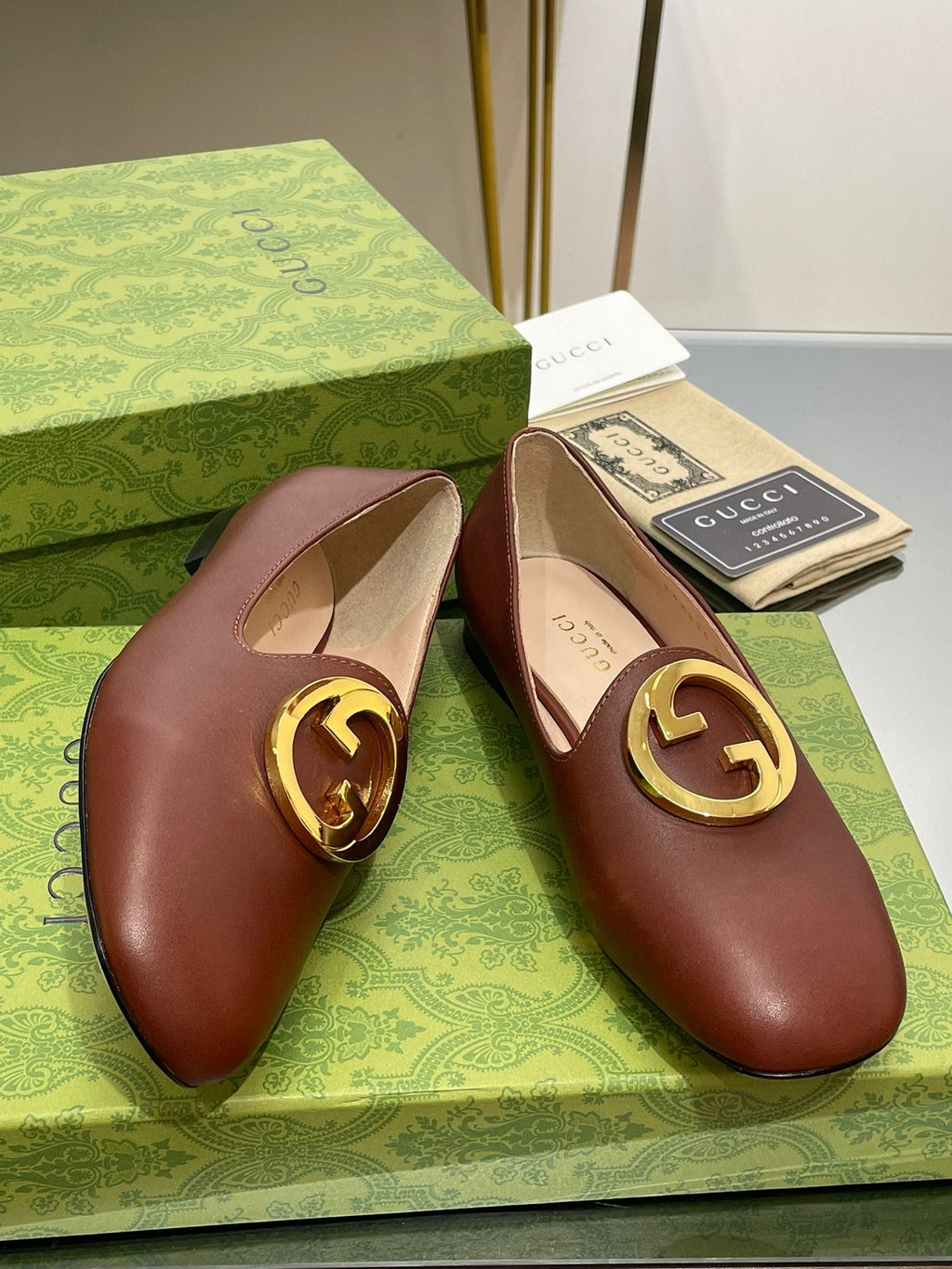 GUCCI BLONDIE LOGO-PLAQUE LOAFERS IN SYRUP BROWN CALFSKIN WITH GOLD HARDWARE