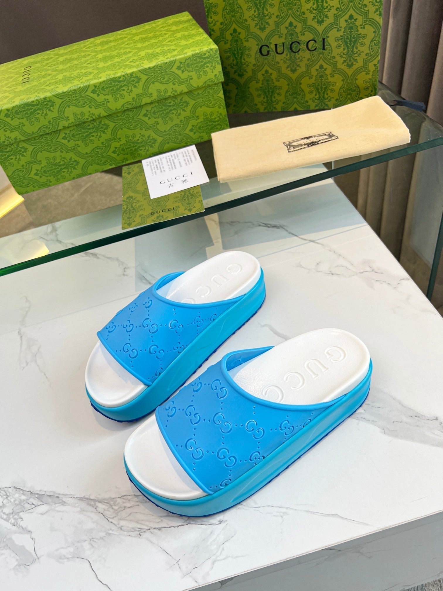 GUCCI PLATFORM SANDALS IN SKY BLUE MONOGRAM IMPORTED TPU
