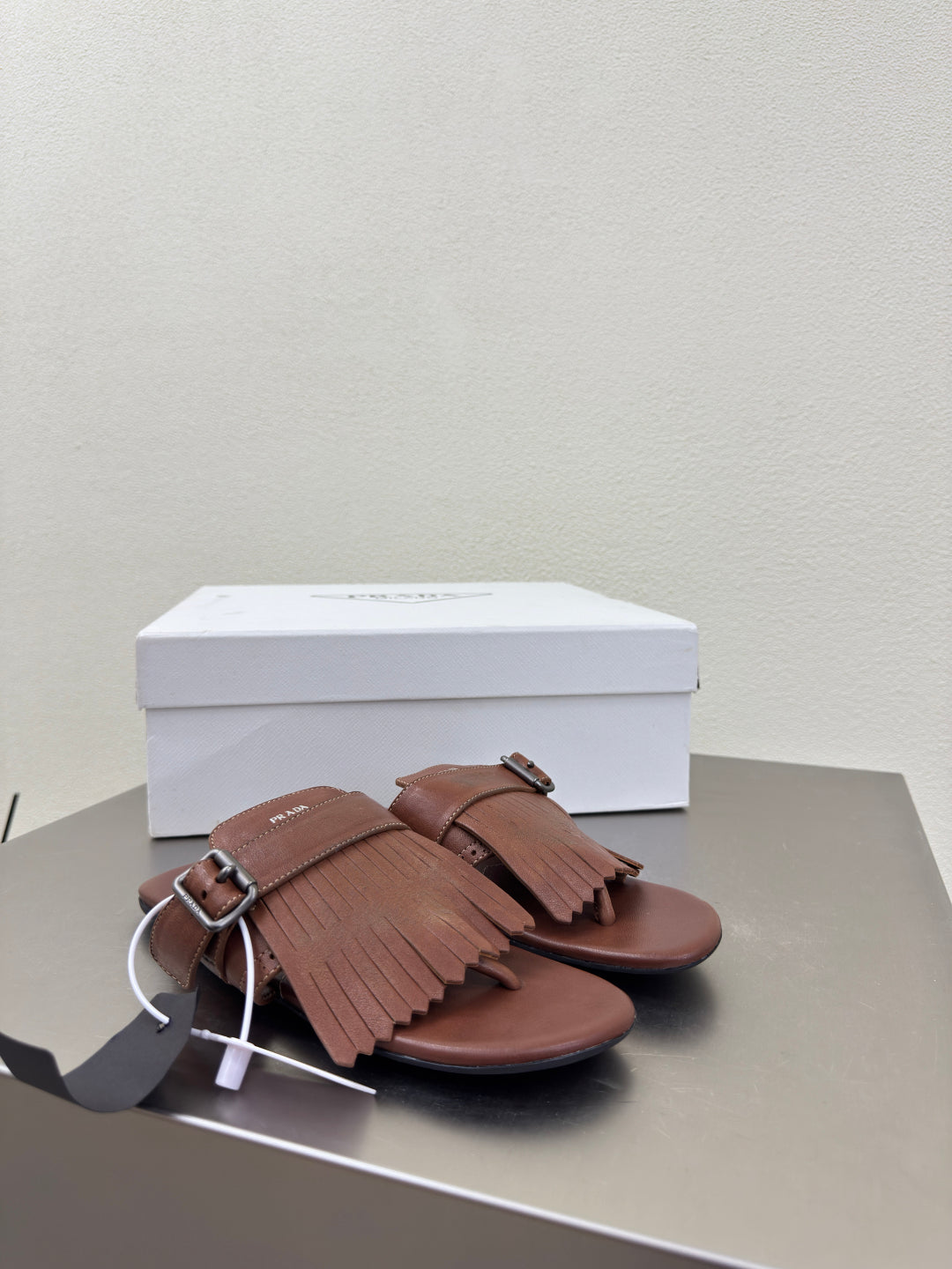 PRADA 25S SHUFFLE LEATHER THONG SANLS IN SIENNA CALFSKIN