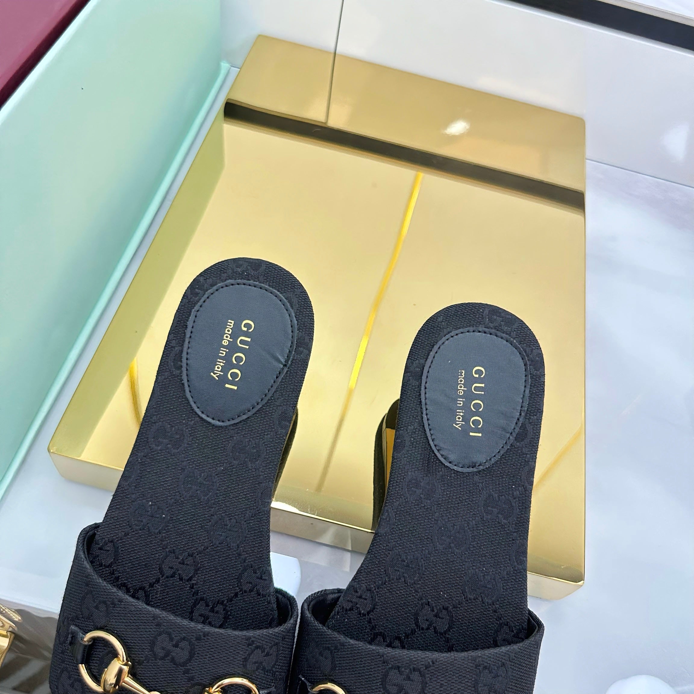 GUCCI SLIDES IN BLACK WITH GOLD HARDWARE