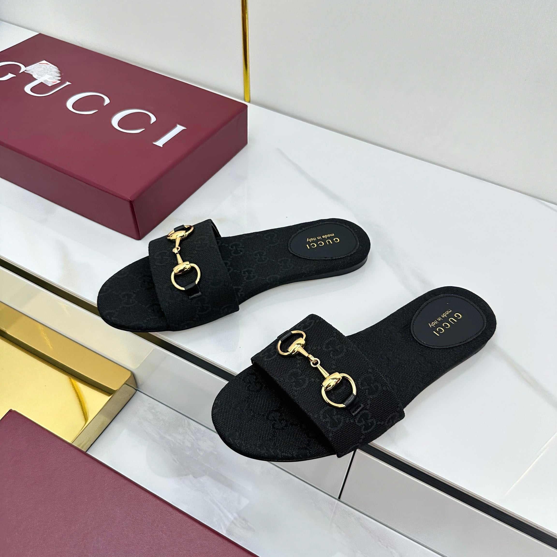 GUCCI SLIDES IN BLACK WITH GOLD HARDWARE