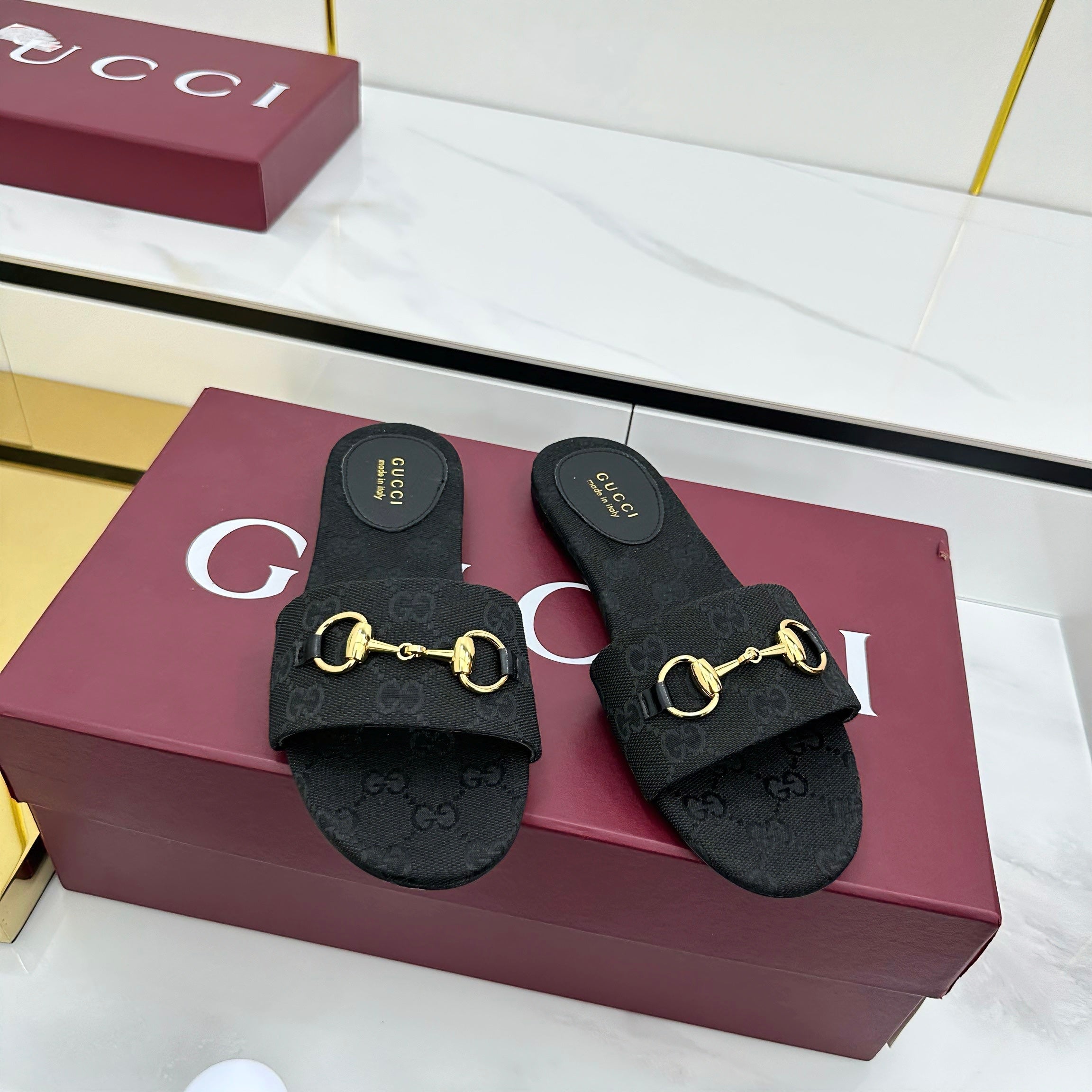 GUCCI SLIDES IN BLACK WITH GOLD HARDWARE