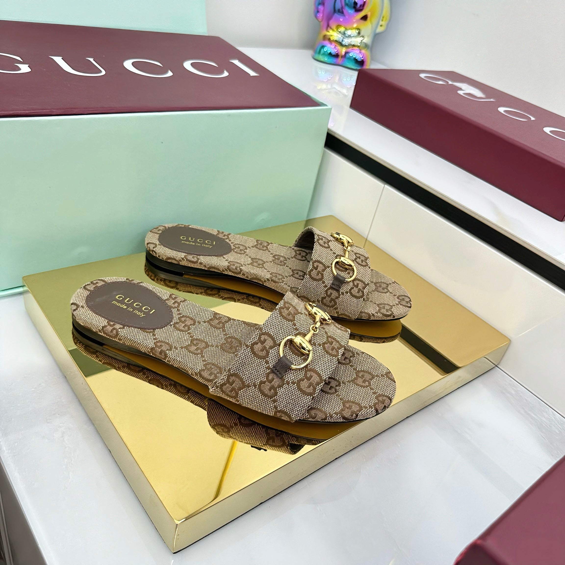 GUCCI SLIDES IN DARK BEIGE WITH GOLD HARDWARE