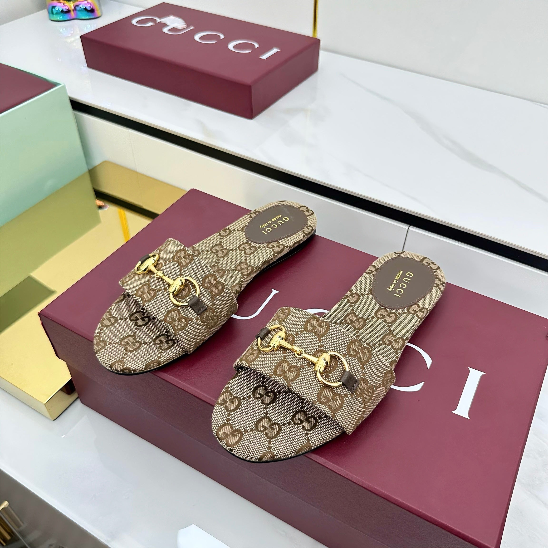 GUCCI SLIDES IN DARK BEIGE WITH GOLD HARDWARE