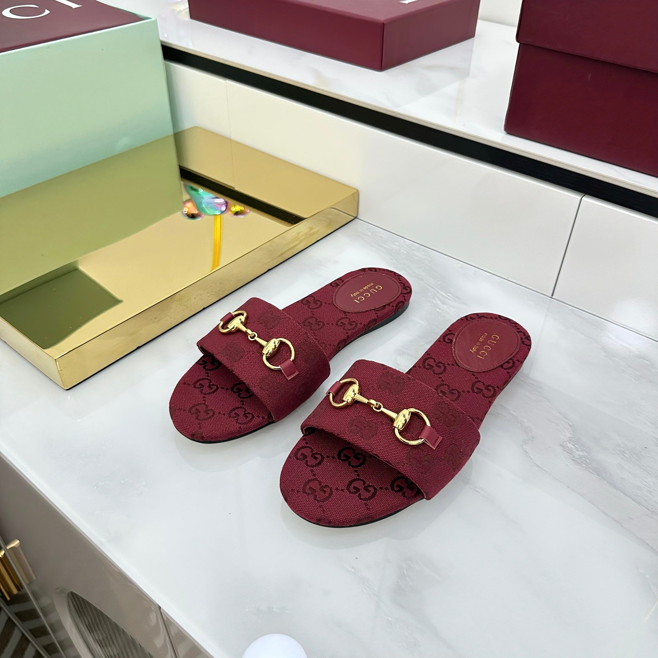 GUCCI SLIDES IN RED WITH GOLD HARDWARE