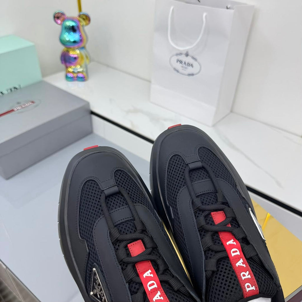 PRADA 25S CROSS LACED SNEAKERS IN BLACK CALFSKIN