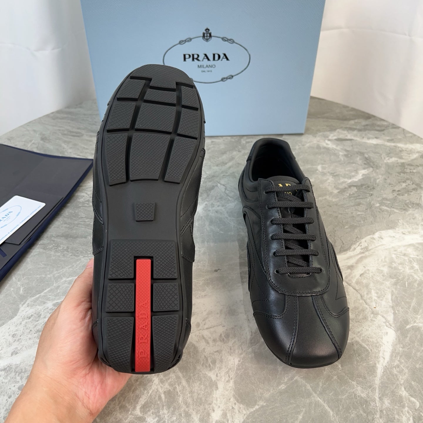 PRADA 25S MONTECARLO ANTIQUED SNEAKERS IN BLACK NAPPA LEATHER