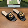 GUCCI FLAT MULE IN BLACK CALFSKIN WITH GOLD HARDWARE