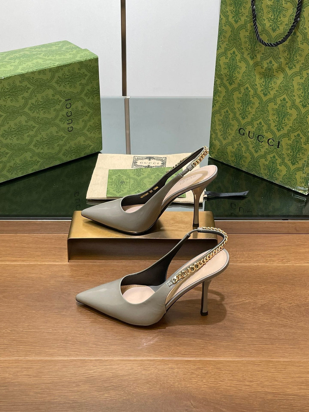 GUCCI HIGH SLINGBACK 10.5 CM IN DOVE GREY GLOSSY CALFSKIN WITH GOLD HARDWARE