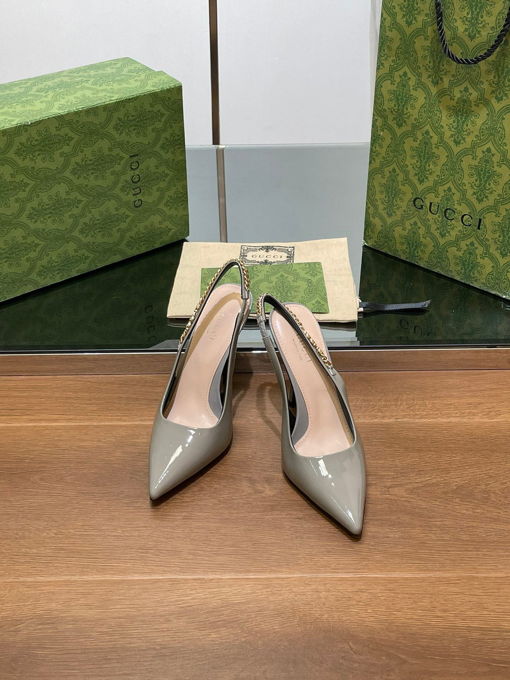 GUCCI HIGH SLINGBACK 10.5 CM IN DOVE GREY GLOSSY CALFSKIN WITH GOLD HARDWARE