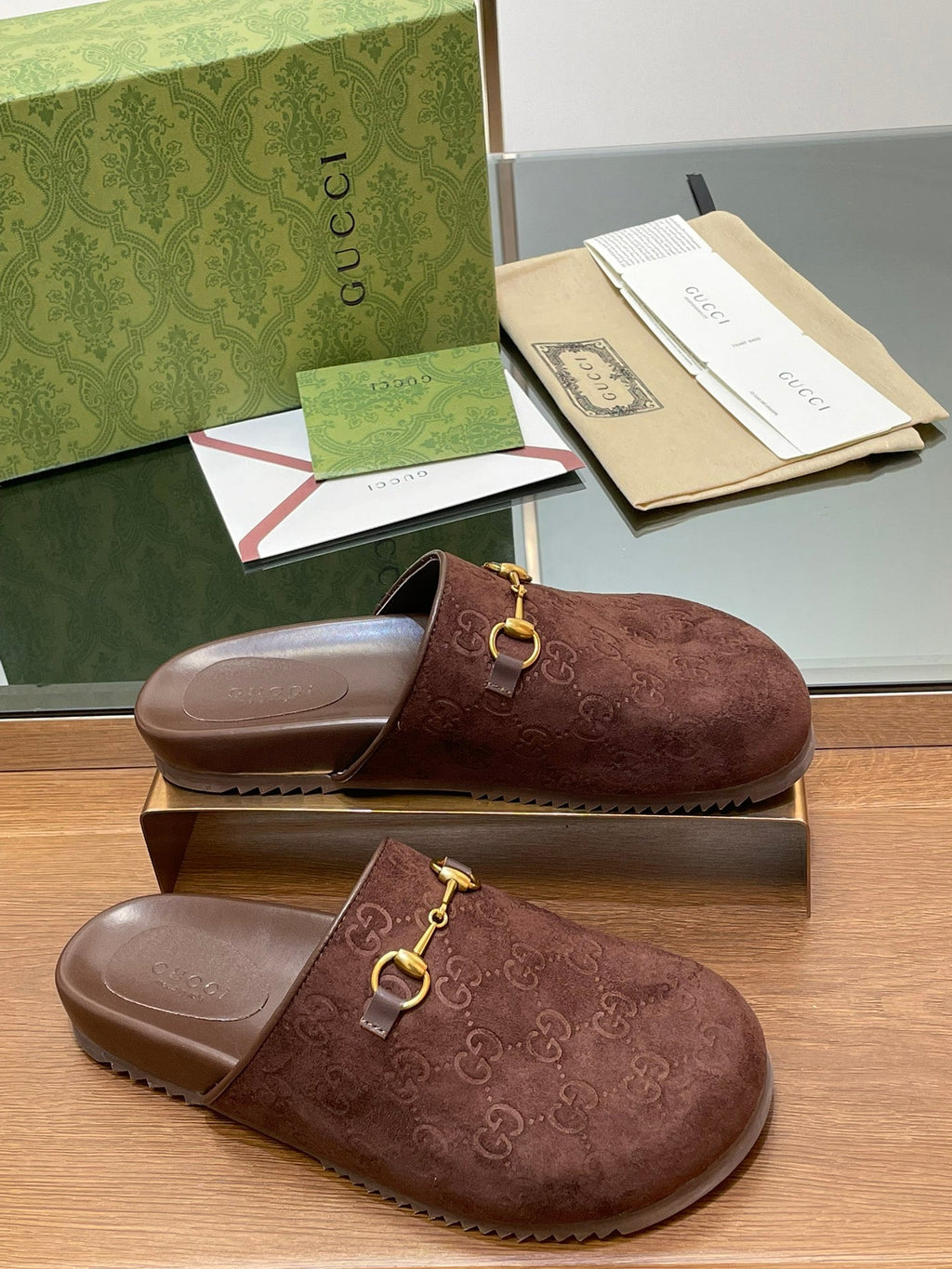 GUCCI HORSEBIT MULE IN CHOCOLATE BROWN EMBOSSED SUEDE AND SHEEPSKIN LINING
