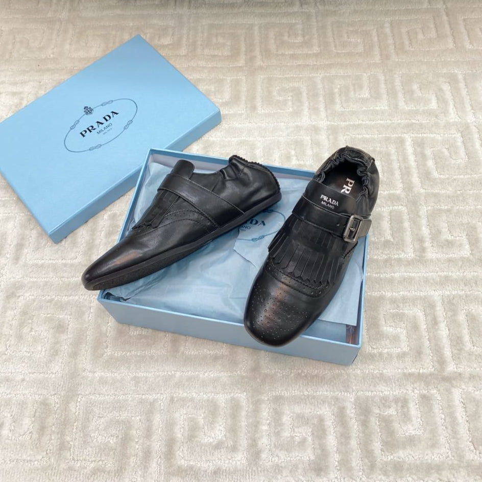 PRADA TASSEL LOAFERS IN BLACK LAMBSKIN