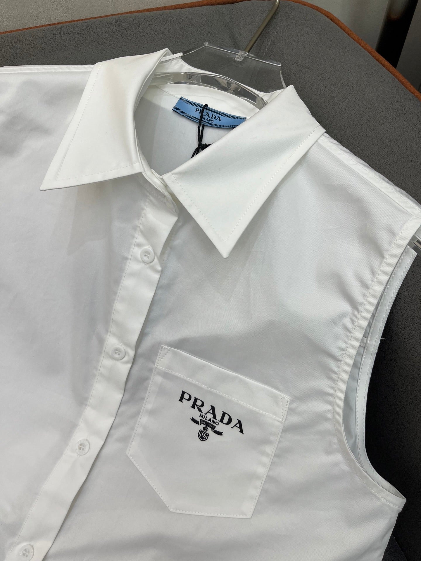 PRADA WHITE SLEEVELESS BUTTON-UP SHIRT