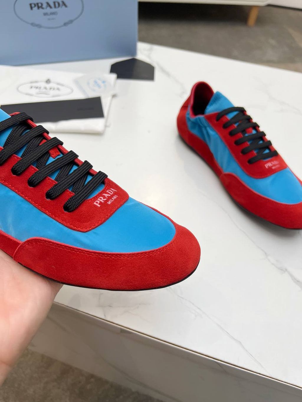PRADA COLLAPSE SNEAKERS IN RED SUEDE AND SKY BLUE NYLON