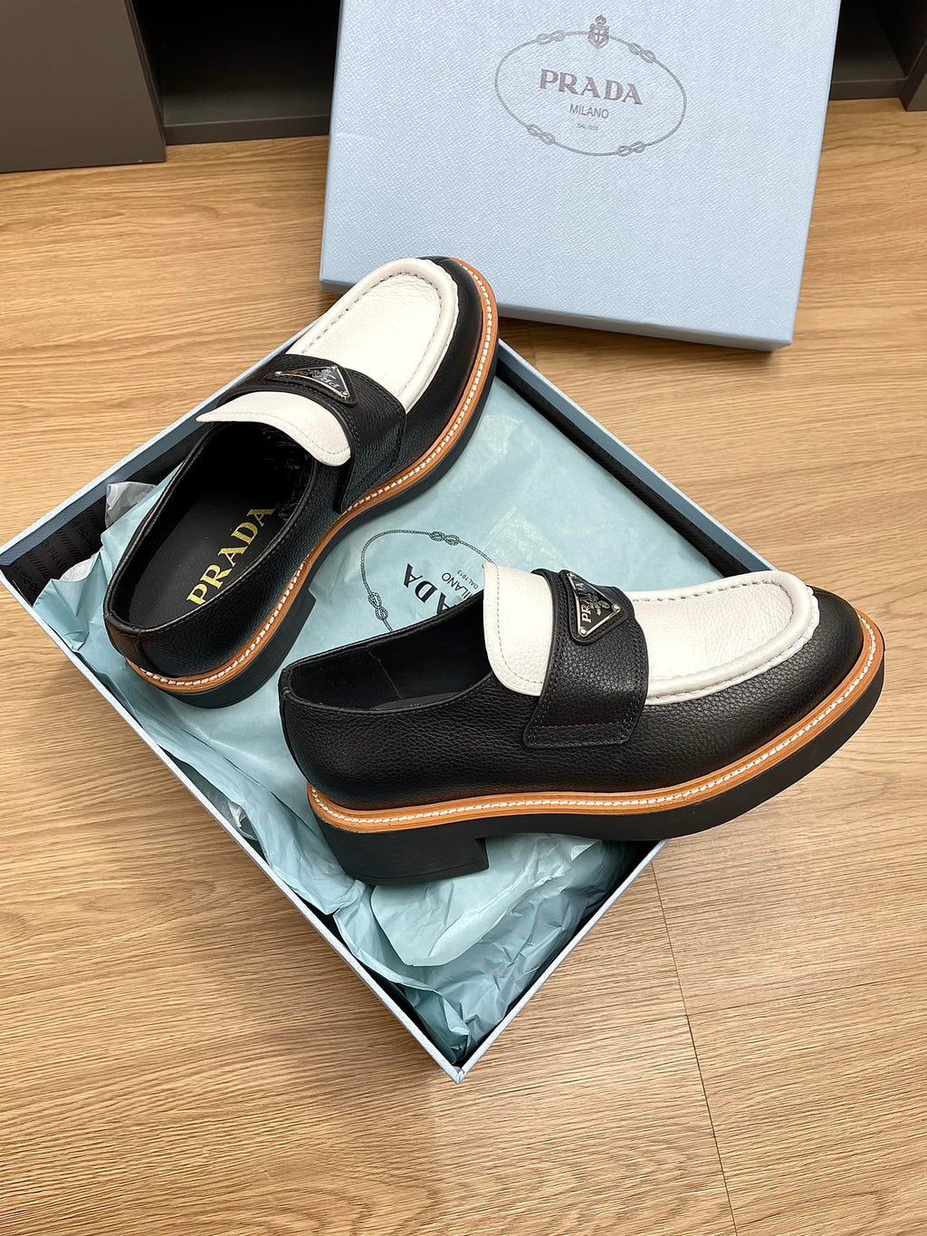 PRADA CHOCOLATE LOAFERS BLACK AND WHITE CALFSKIN