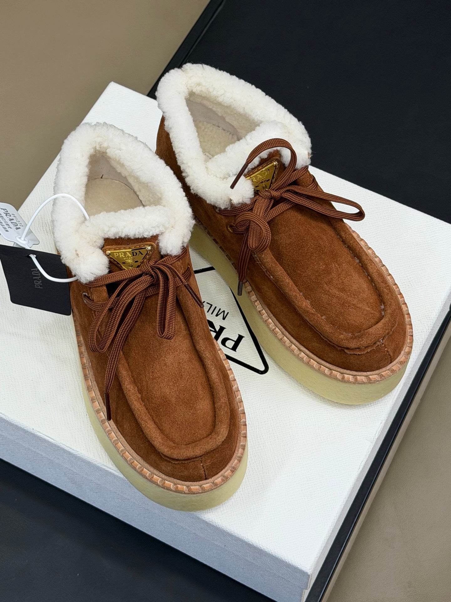 PRADA 25S HIGH-TOP SHOES 40 MM IN RK BROWN SUEDE SHEARLING-LINED