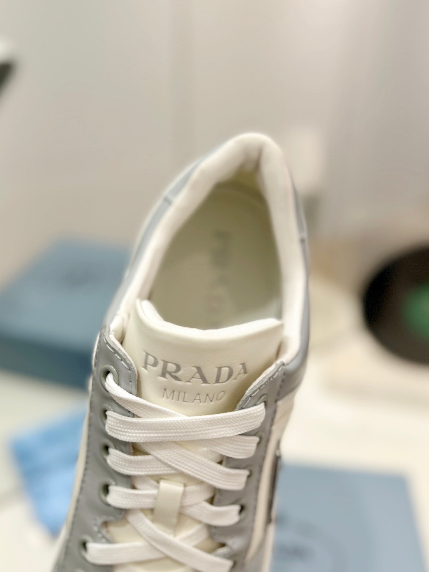 PRADA DOWNTOWN PERFORATED SNEAKERS WHITE AND GRAY CALFSKIN