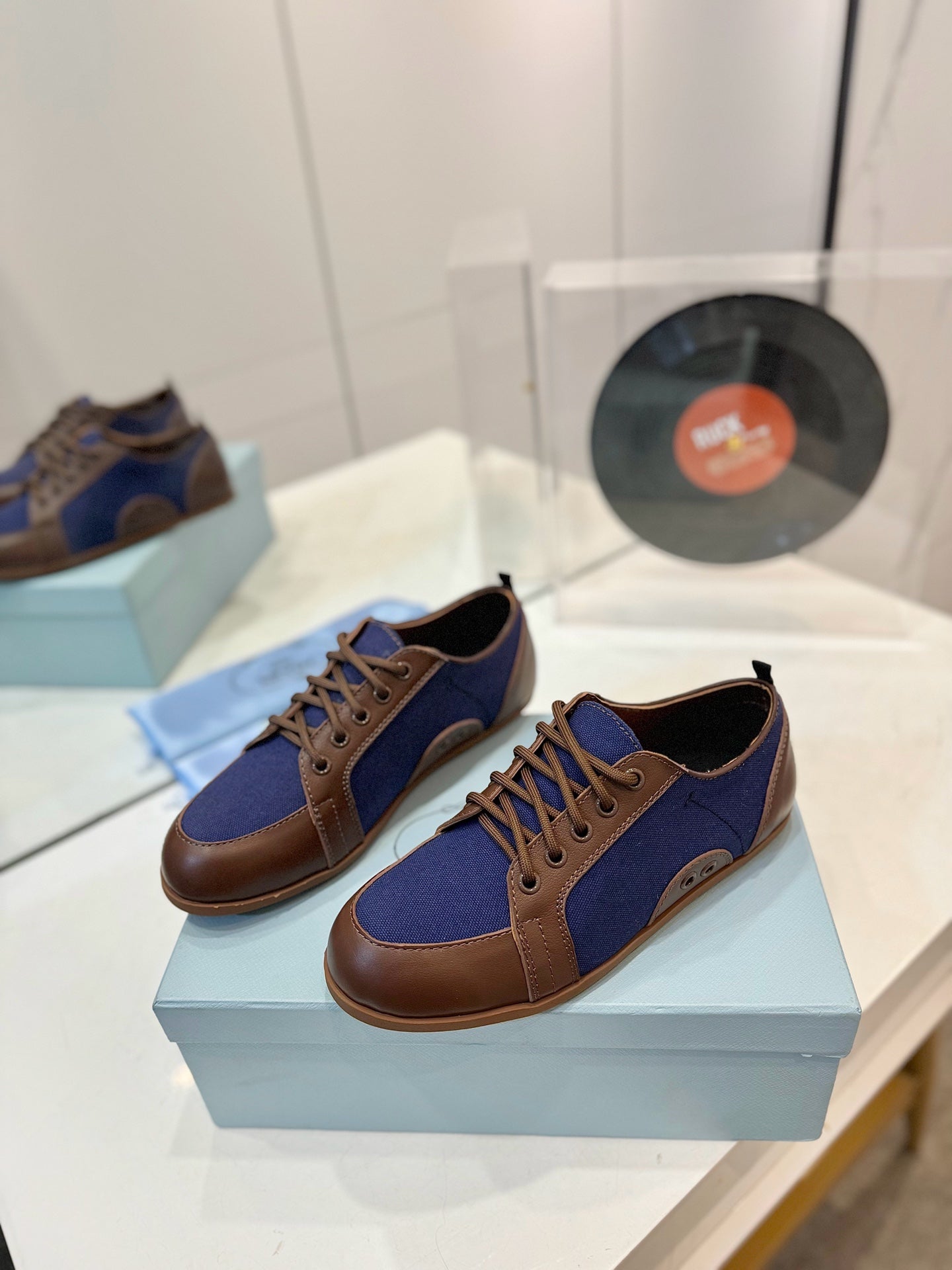 PRADA SNEAKERS IN BROWN LAMBSKIN AND NAVY BLUE CANVAS