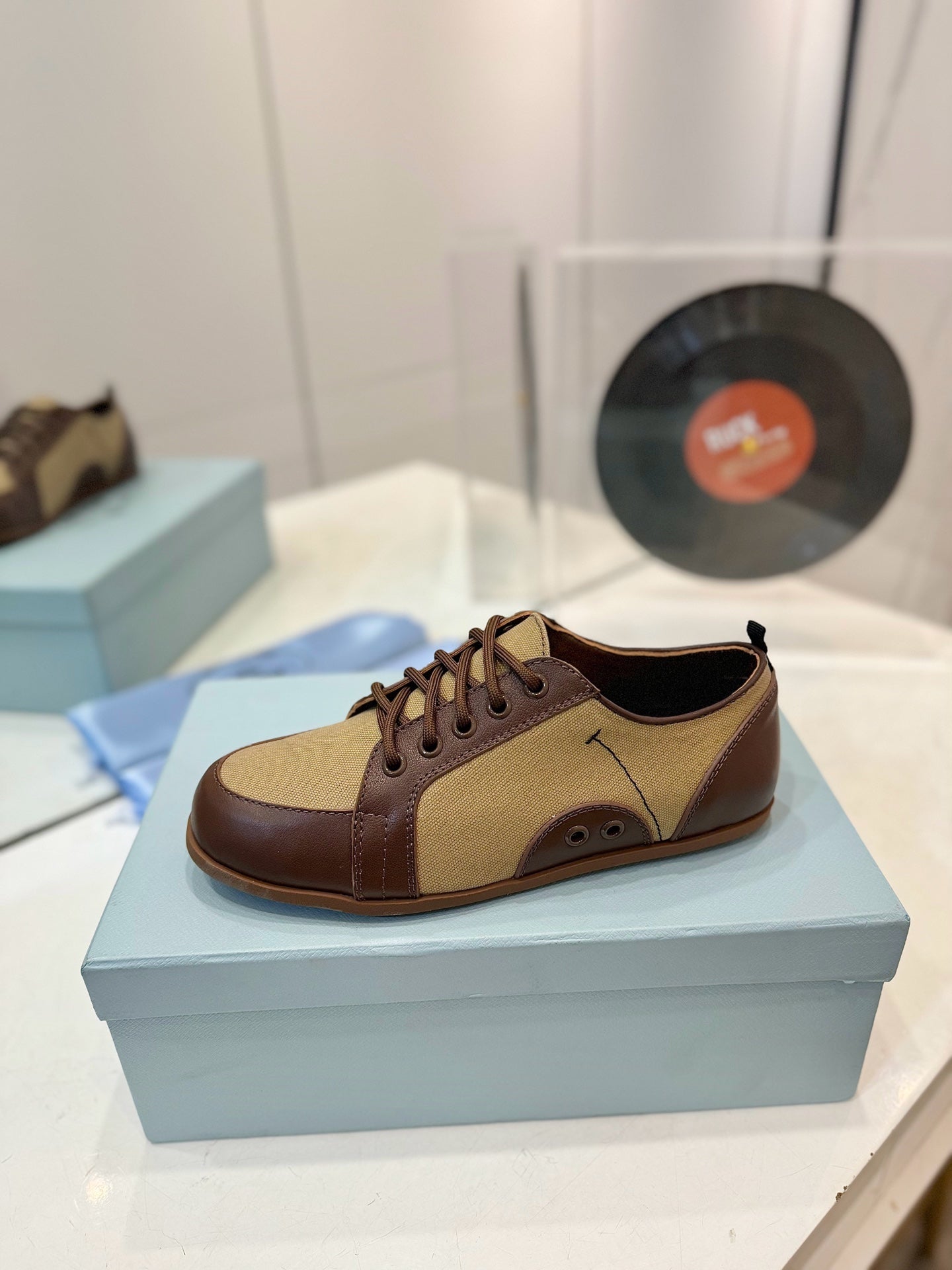 PRADA SNEAKERS IN BROWN LAMBSKIN AND BEIGE CANVAS